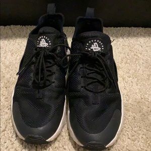 Women’s black Huraches.